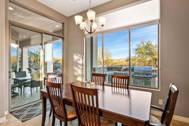 dining space with a notable chandelier