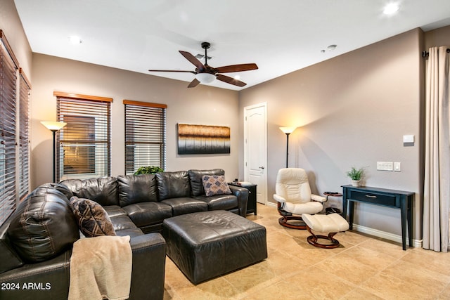 living room with light tile patterned floors and ceiling fan