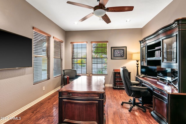 office with wood-type flooring and ceiling fan