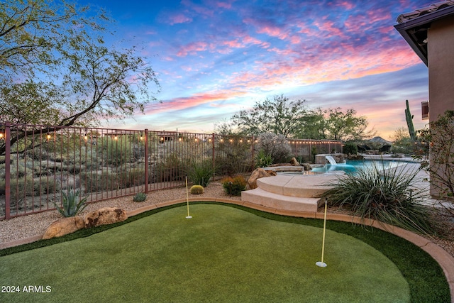 view of yard at dusk