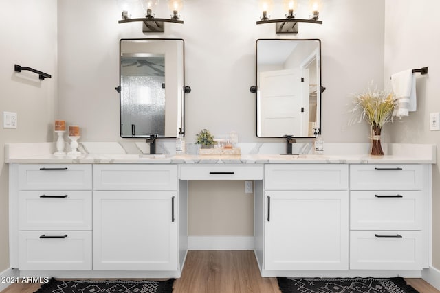 bathroom featuring hardwood / wood-style floors and vanity