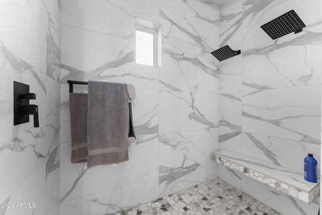 interior details with a tile shower