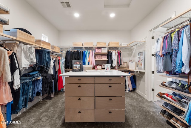 spacious closet featuring dark carpet