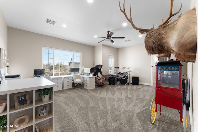 miscellaneous room with ceiling fan and carpet