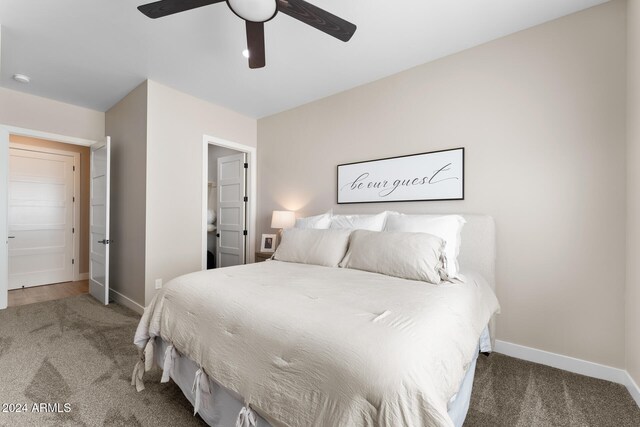 carpeted bedroom featuring ceiling fan