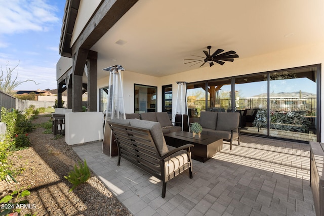 view of patio featuring an outdoor living space and ceiling fan