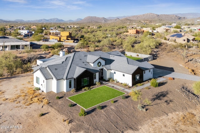 birds eye view of property with a mountain view