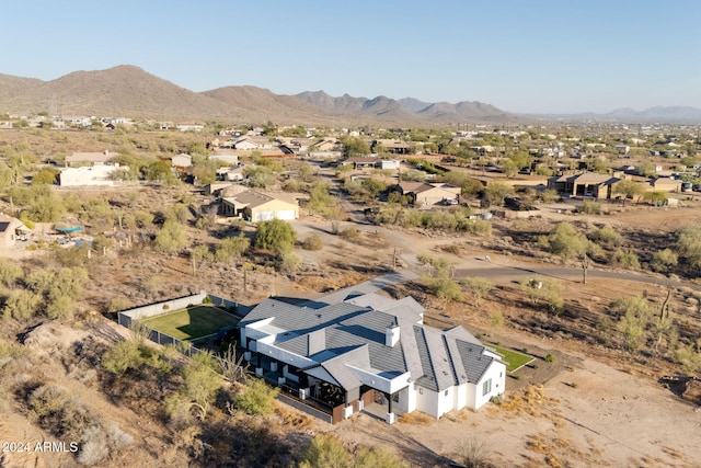 birds eye view of property with a mountain view