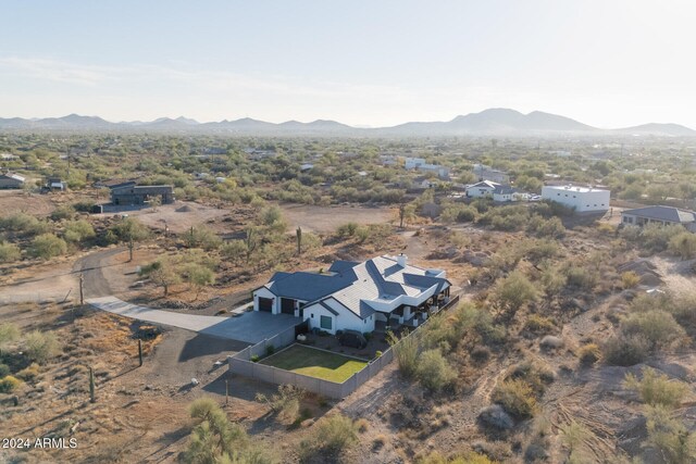 birds eye view of property featuring a mountain view