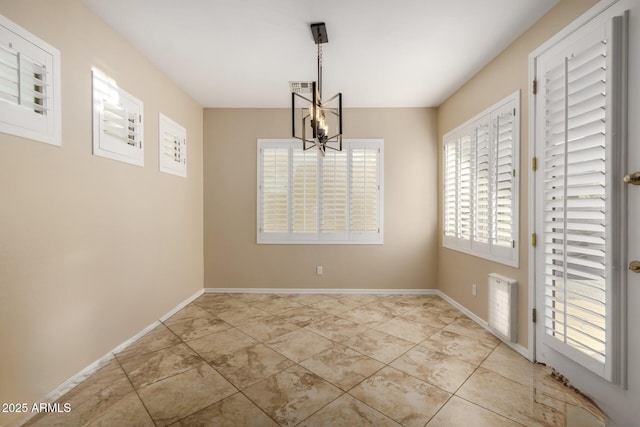 unfurnished dining area with a chandelier, visible vents, baseboards, and light tile patterned floors