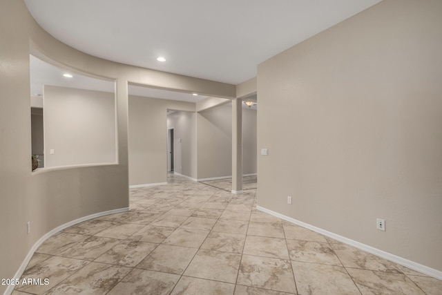 basement featuring recessed lighting and baseboards