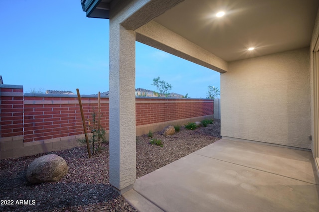 view of patio terrace at dusk