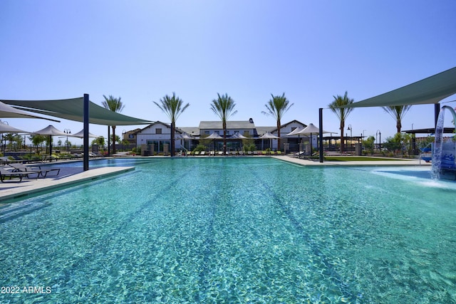 view of swimming pool featuring pool water feature