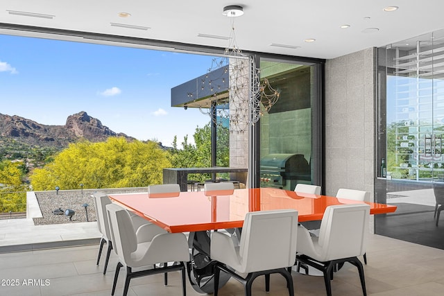 view of patio with grilling area and a mountain view