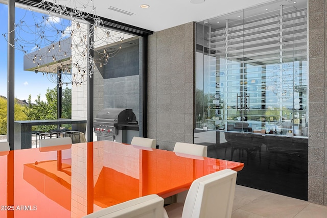 dining area with tile patterned flooring