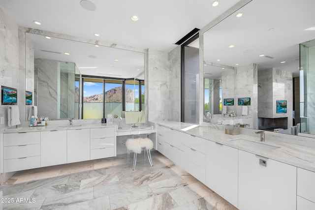 bathroom with tile walls and vanity