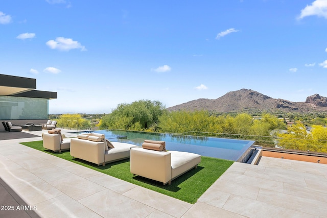 view of patio with a water and mountain view and an outdoor hangout area