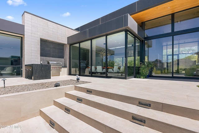 view of patio with grilling area and exterior kitchen