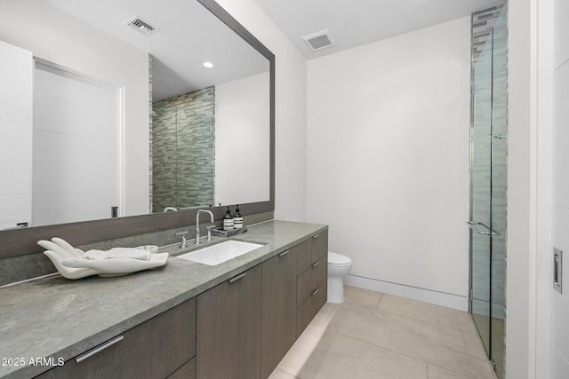 bathroom with walk in shower, tile patterned floors, toilet, and vanity