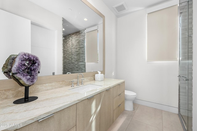 bathroom with walk in shower, vanity, toilet, and tile patterned flooring