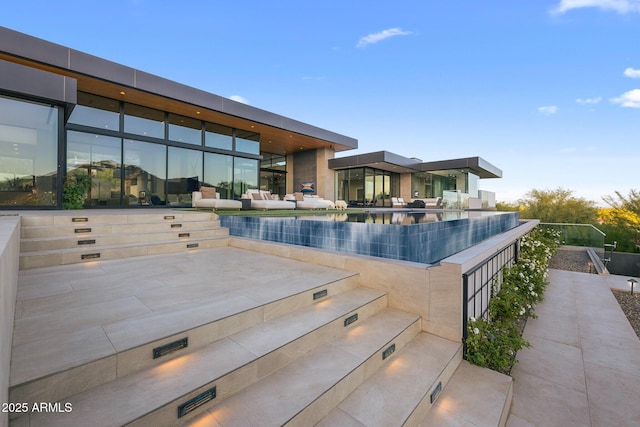 view of swimming pool with a patio area