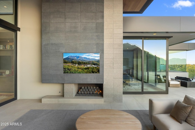 interior space featuring an outdoor living space and a mountain view