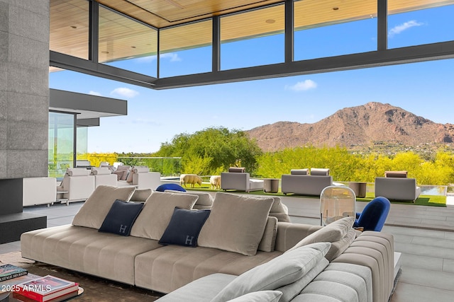 view of patio / terrace featuring an outdoor living space and a mountain view