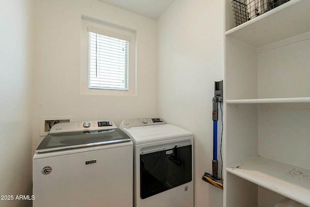 clothes washing area with independent washer and dryer