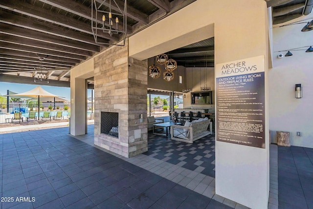 view of patio / terrace with an outdoor stone fireplace