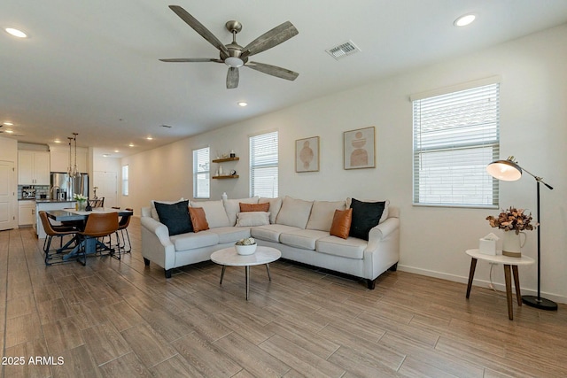 living room featuring ceiling fan