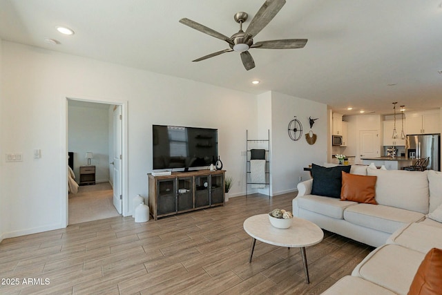 living room with ceiling fan