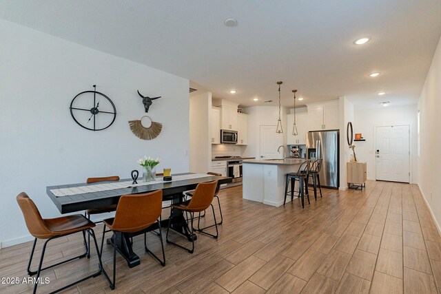 dining space featuring sink