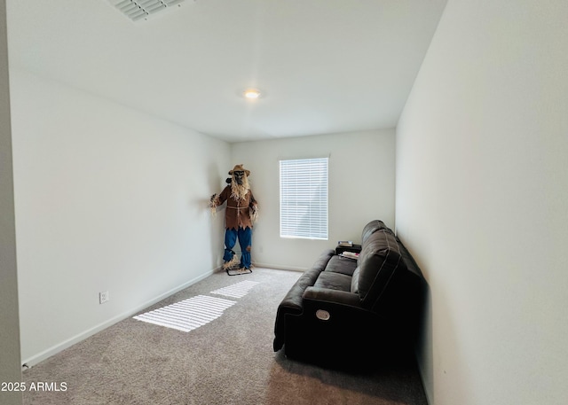 sitting room with carpet flooring and baseboards