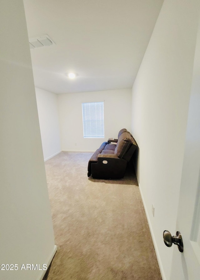 unfurnished room featuring carpet floors and baseboards