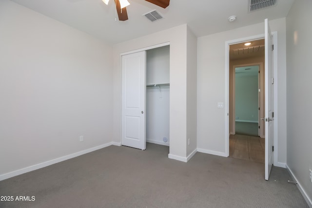 unfurnished bedroom with visible vents, baseboards, and carpet