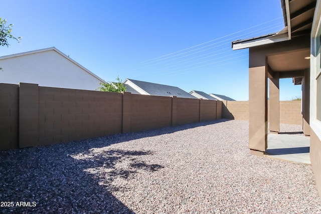 view of yard with a patio area and a fenced backyard