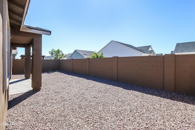 view of yard with a patio and a fenced backyard