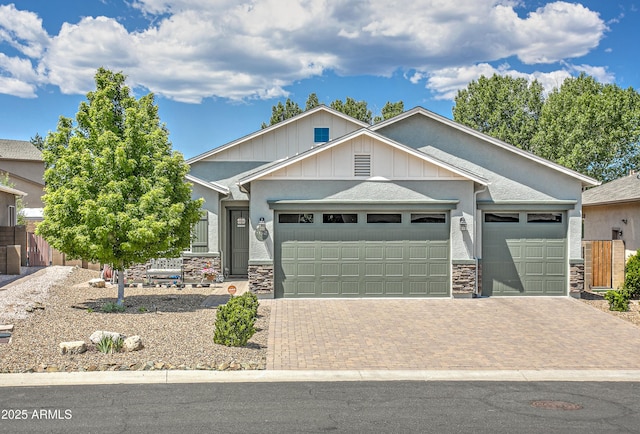 932 N Gomez St, Dewey, AZ 86327 - view of front of property with a garage, decorative driveway, stone siding, and board and batten siding