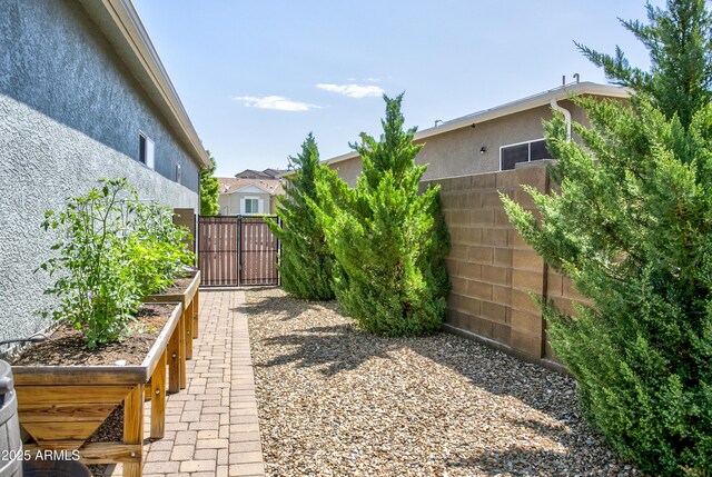 932 N Gomez St, Dewey, AZ 86327 - view of yard featuring a gate and a vegetable garden