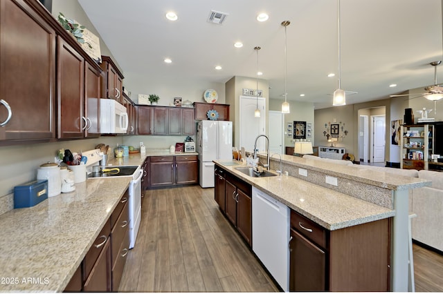 932 N Gomez St, Dewey, AZ 86327 - kitchen featuring white appliances, open floor plan, recessed lighting, a center island with sink, and dark wood finished floors
