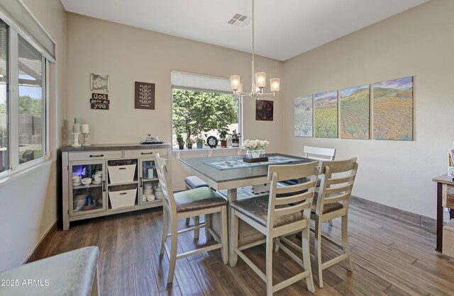932 N Gomez St, Dewey, AZ 86327 - dining space featuring a chandelier, wood finished floors, and healthy amount of natural light