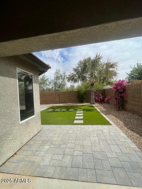exterior space with a fenced backyard