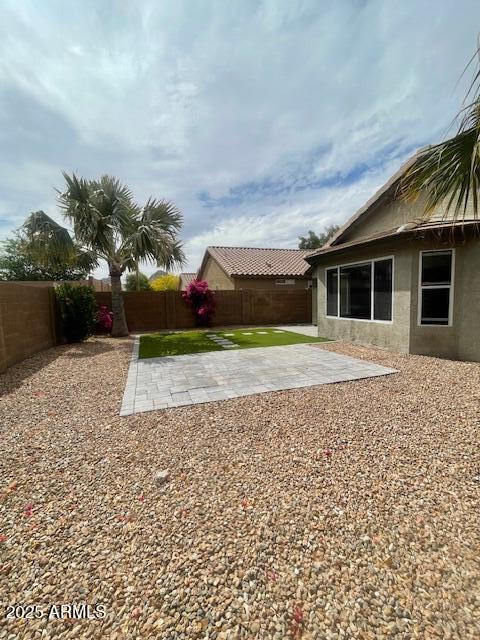 view of yard with a fenced backyard and a patio