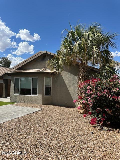 view of property exterior with a patio area and stucco siding