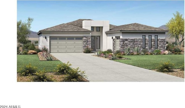 view of front of house with a garage and a front lawn