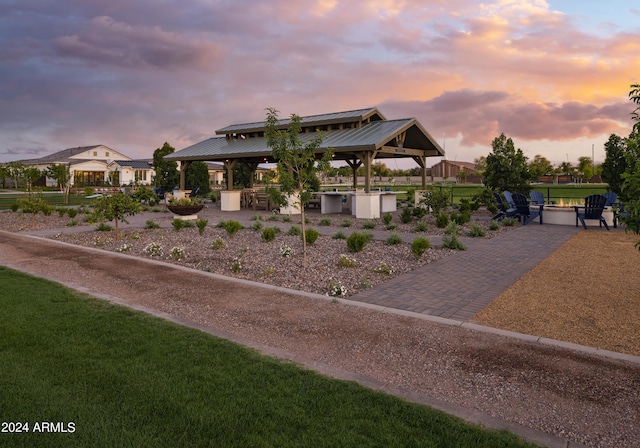 view of front of home featuring exterior bar, a gazebo, a patio area, and exterior kitchen