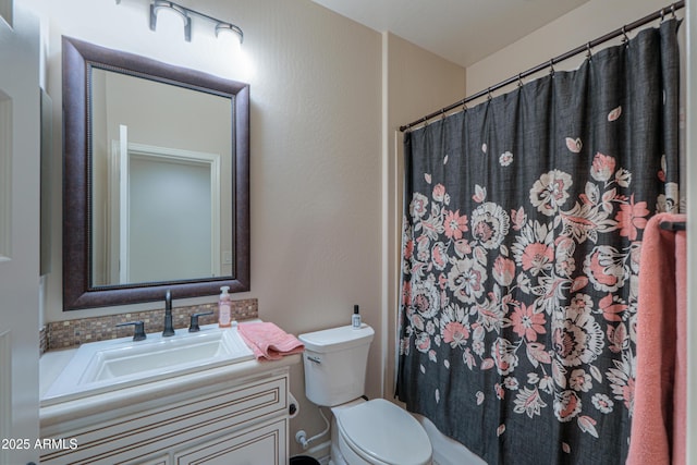 bathroom with vanity, toilet, and a shower with shower curtain