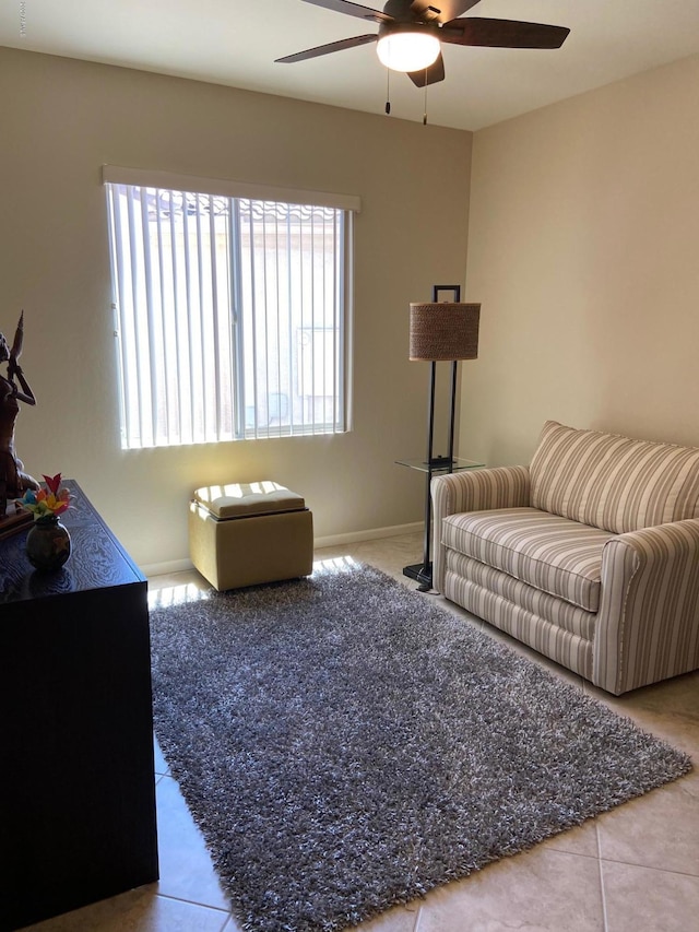 living room with tile patterned floors and ceiling fan