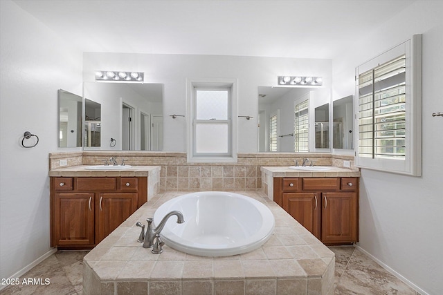 970 S Henry Ln, Gilbert, AZ 85296 - bathroom featuring two vanities and a garden tub