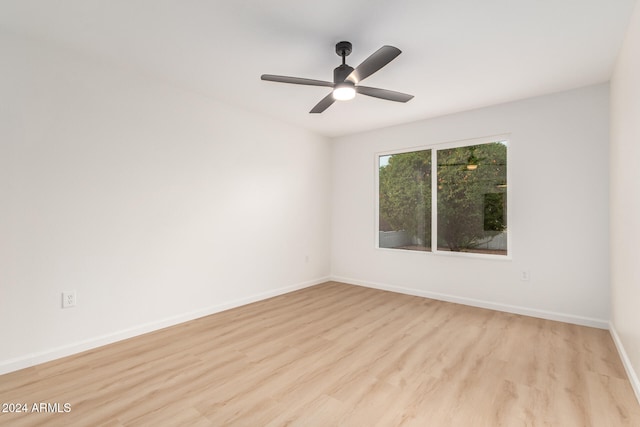 spare room with ceiling fan and light hardwood / wood-style floors